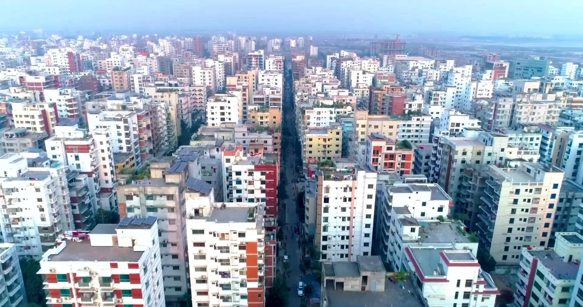 Drone view over the Bashundhara Residential Area grid at dusk