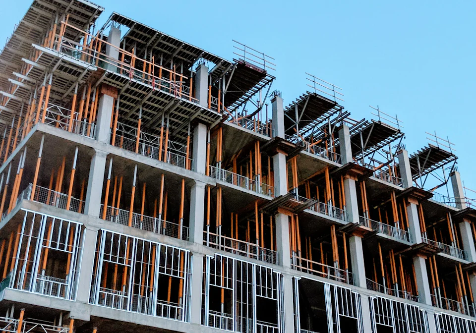 The reinforced concrete frame of an apartment building, shuttering still in place